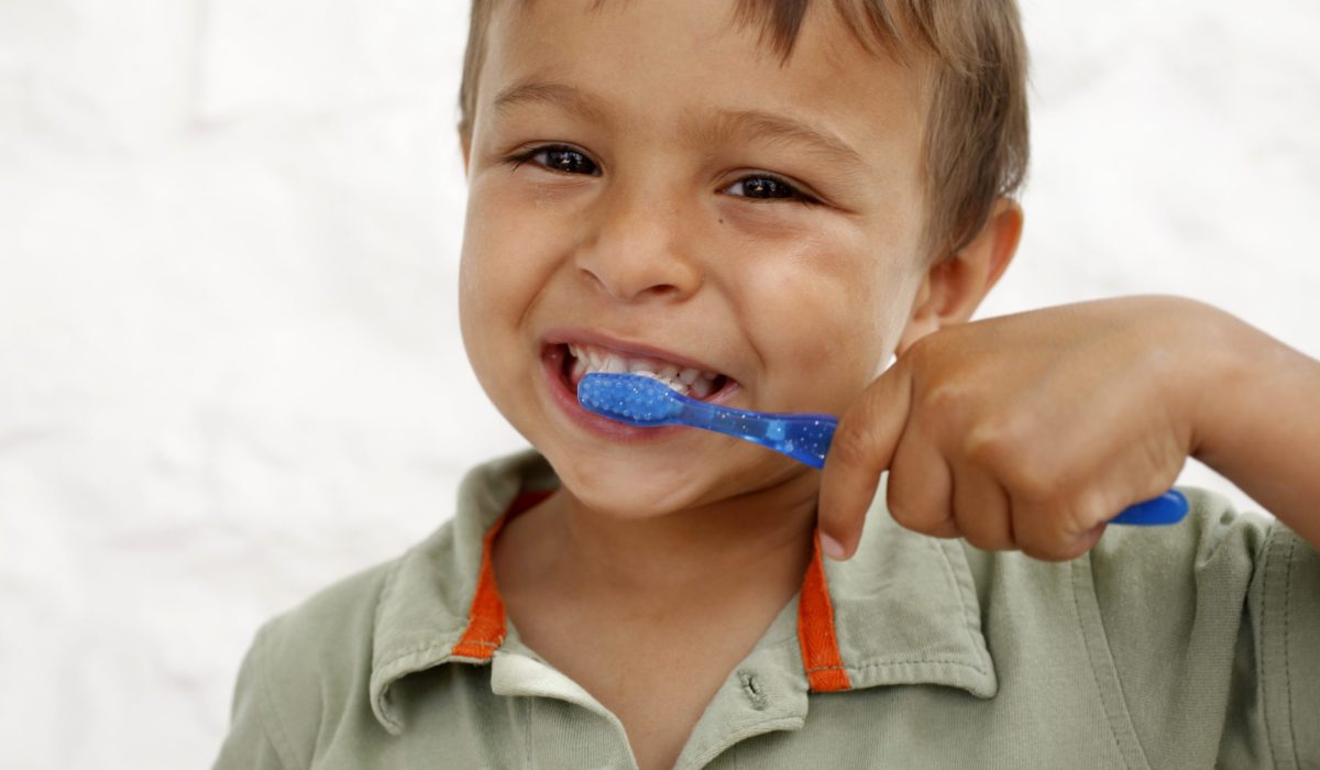 Young boy brushing teeth, Italy. (Photo by: Godong/UIG via Getty Images)