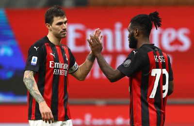 MILAN, ITALY - MARCH 03: Franck Kessie of Milan  celebrates with teammate Jens Petter Hauge  after scoring their team's first goal  during the Serie A match between AC Milan  and Udinese Calcio at Stadio Giuseppe Meazza on March 03, 2021 in Milan, Italy. Sporting stadiums around Italy remain under strict restrictions due to the Coronavirus Pandemic as Government social distancing laws prohibit fans inside venues resulting in games being played behind closed doors. (Photo by Marco Luzzani/Getty Images)